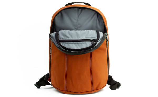 The Luminary 15 in Burnt Orange 525 Ballistic with a Cloud (light grey) 210 Ballistic interior.